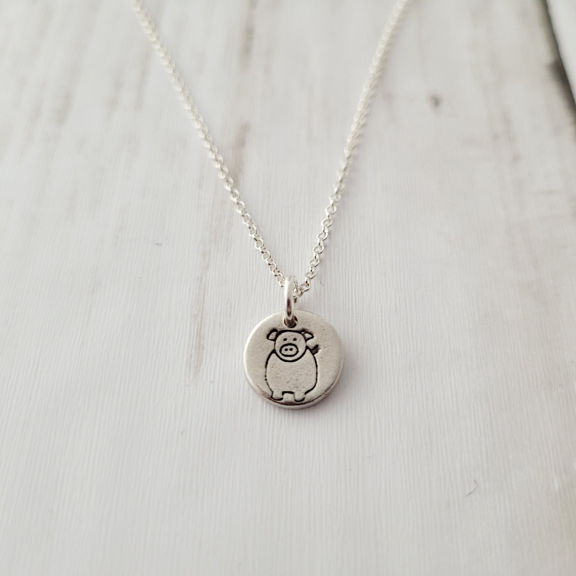 Sterling-silver-tiny-pig-pendant-necklace-2