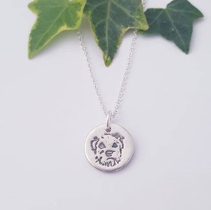border terrier dog pendant on white background