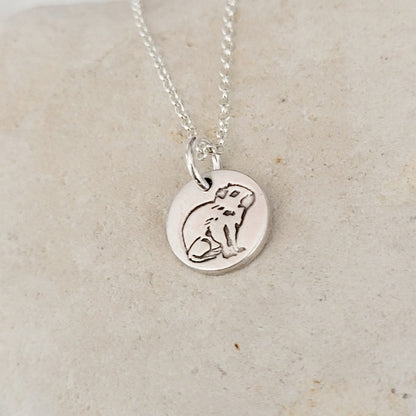sterling silver round capybara pendant on white stone