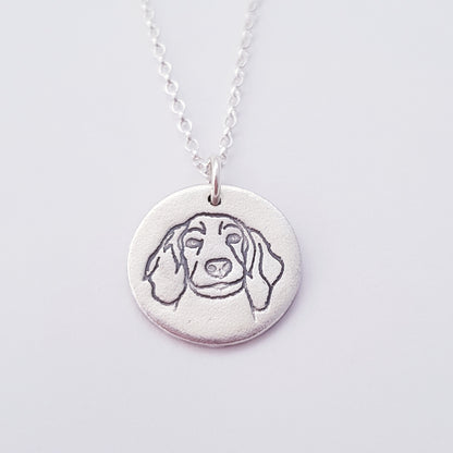 Sterling-silver-round dog pendant on white background
