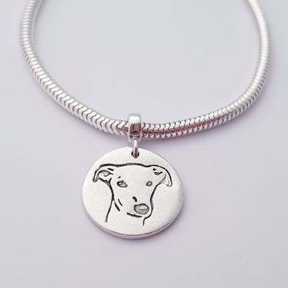 greyhound dog pendant hanging on snake chain