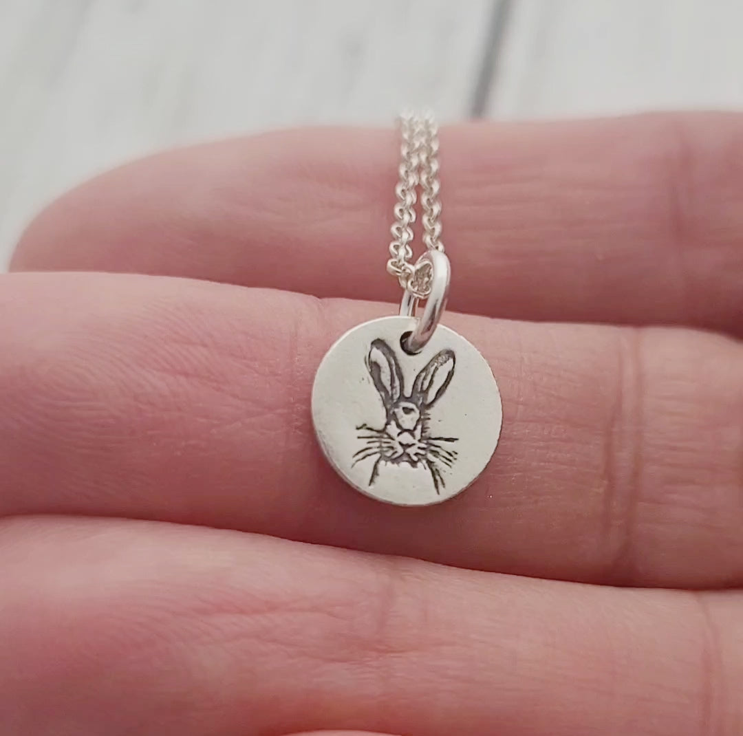 round hare animal pendant held video