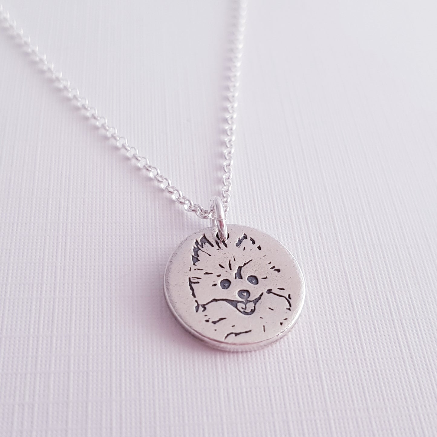 round cute dog face pendant side view