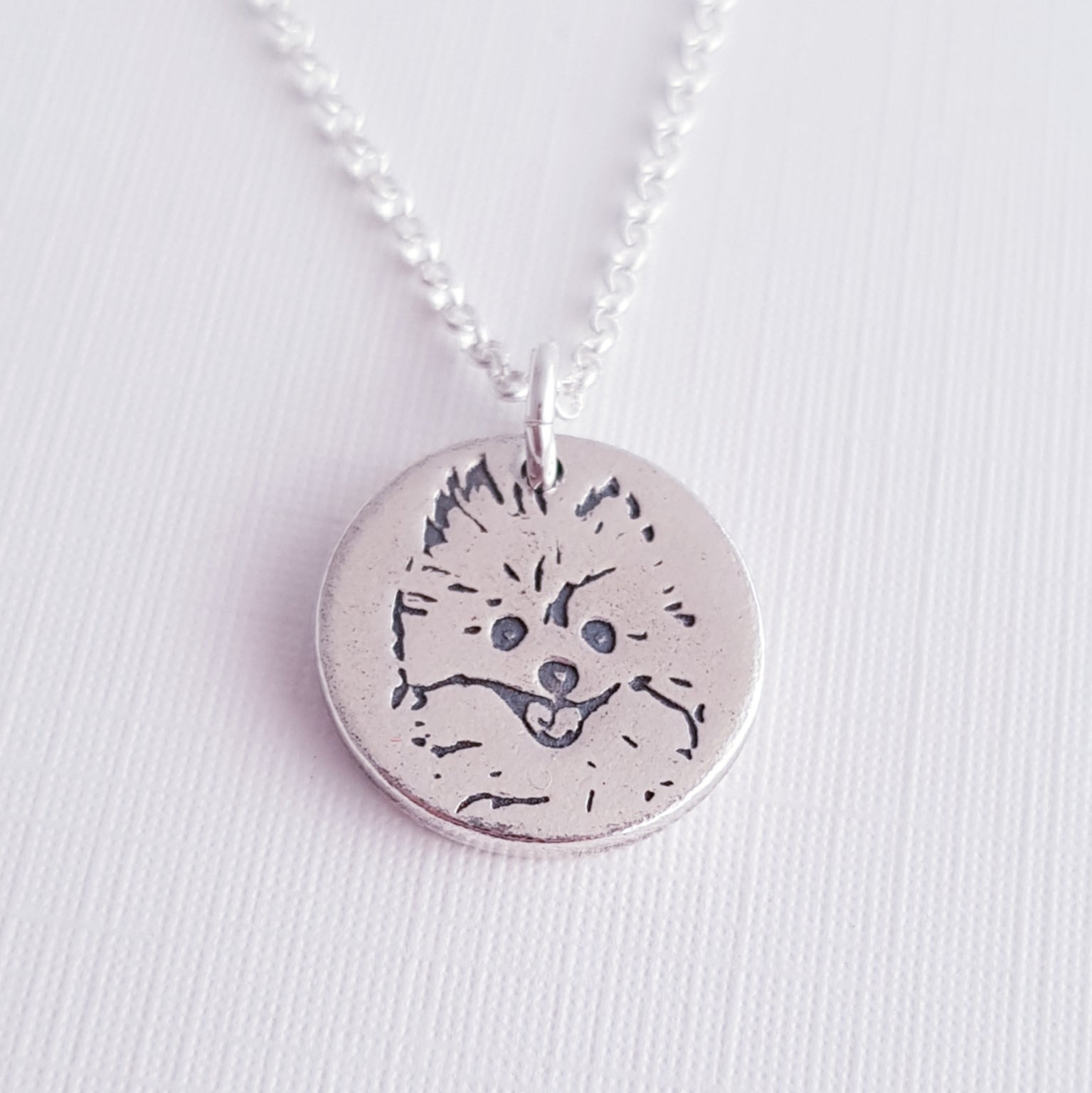 round silver dog face pendant