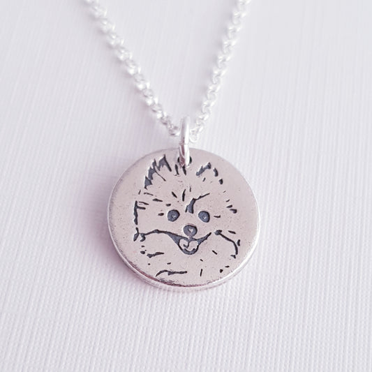 round silver dog face pendant