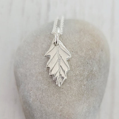 sterling silver oak leaf necklace on stone
