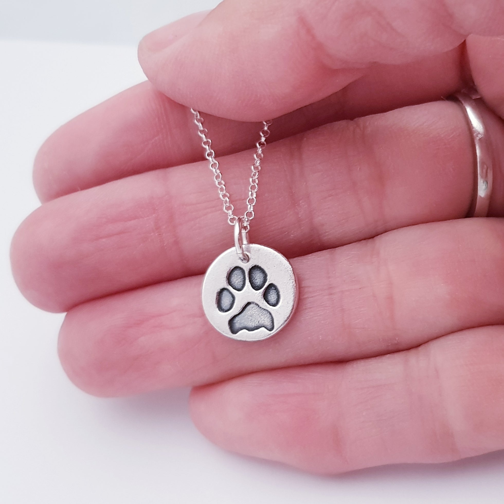 Sterling Silver Paw Print Necklace By PoppyK | notonthehighstreet.com